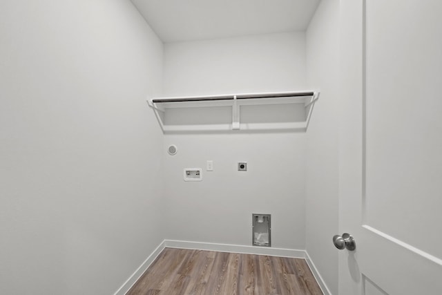 laundry area featuring hardwood / wood-style flooring, gas dryer hookup, washer hookup, and hookup for an electric dryer