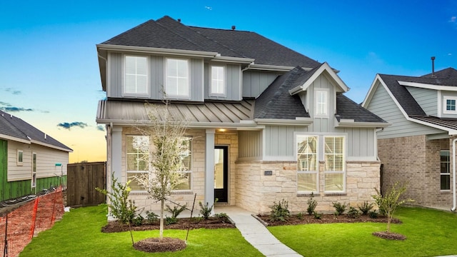 view of front of home with a lawn