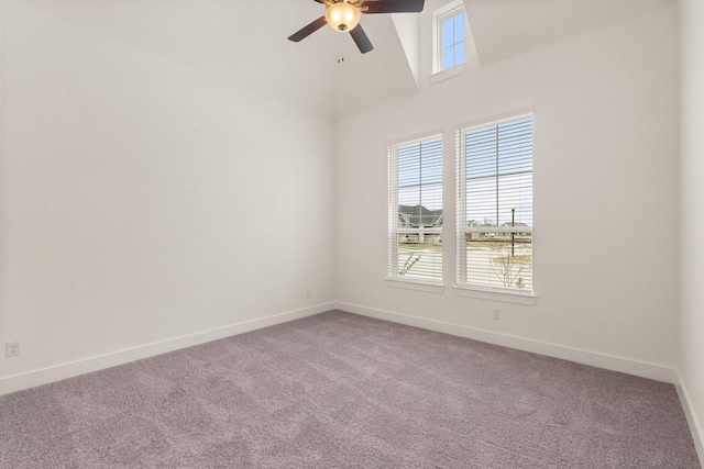 spare room with carpet floors, plenty of natural light, baseboards, and a ceiling fan