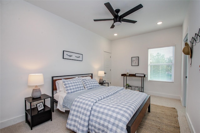 bedroom featuring ceiling fan and light colored carpet