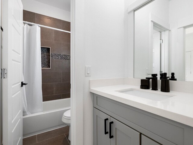 full bathroom with toilet, vanity, tile patterned flooring, and shower / bath combination with curtain