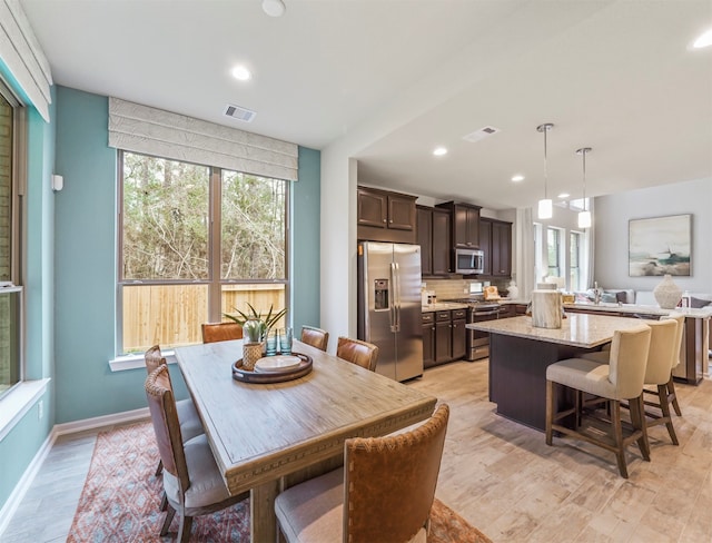 dining room with light hardwood / wood-style floors