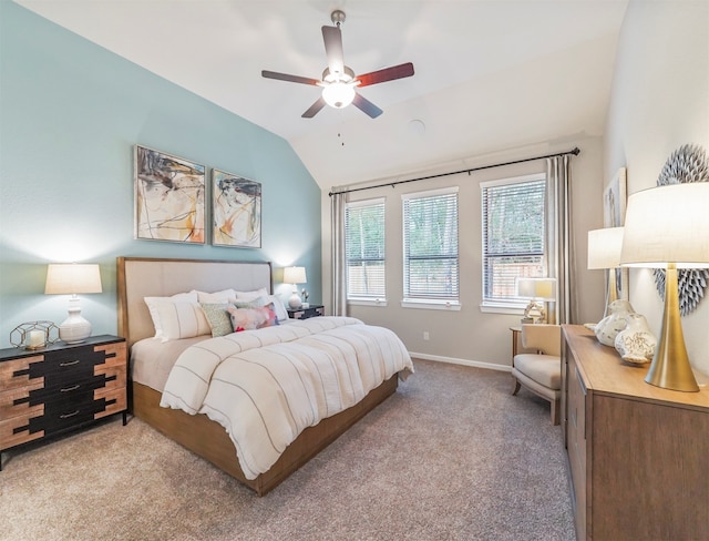 carpeted bedroom featuring lofted ceiling and ceiling fan