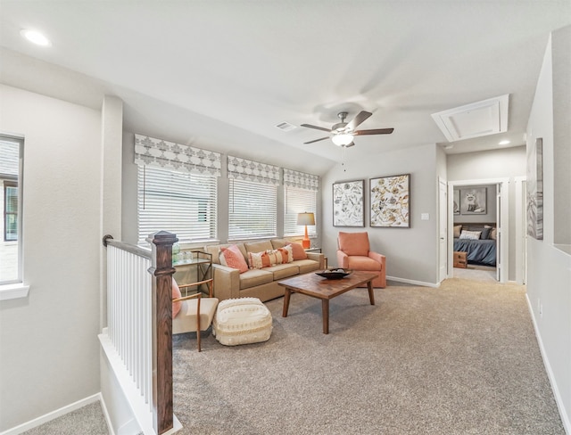 carpeted living room featuring ceiling fan