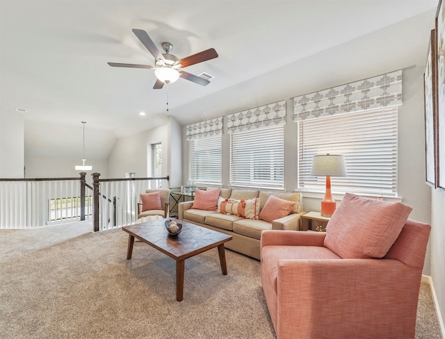 carpeted living room featuring lofted ceiling and ceiling fan