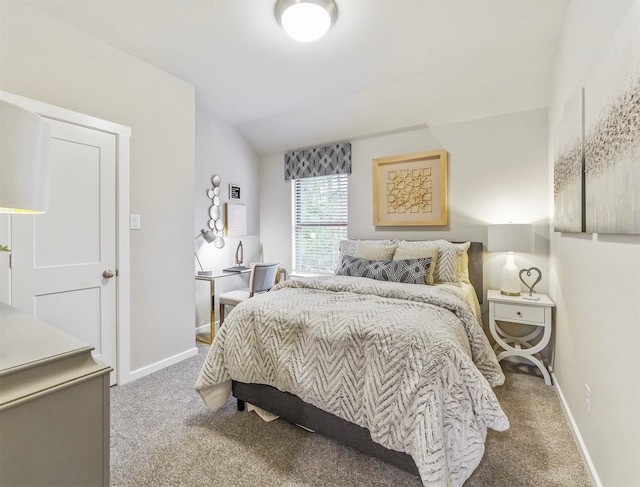 carpeted bedroom featuring vaulted ceiling