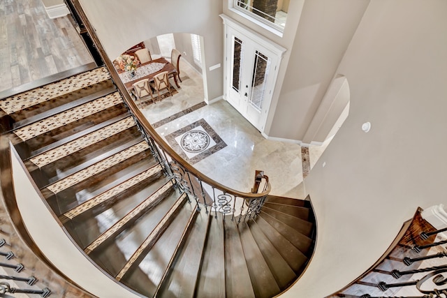 staircase with tile patterned floors