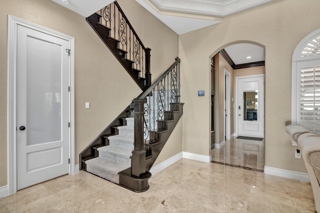 tiled entryway with crown molding