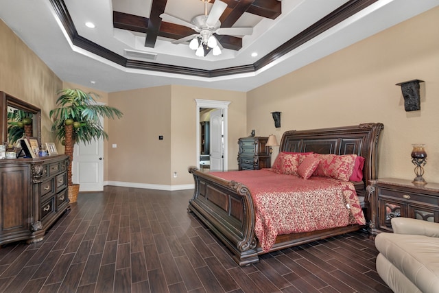 bedroom featuring ceiling fan, dark wood-type flooring, coffered ceiling, and a tray ceiling