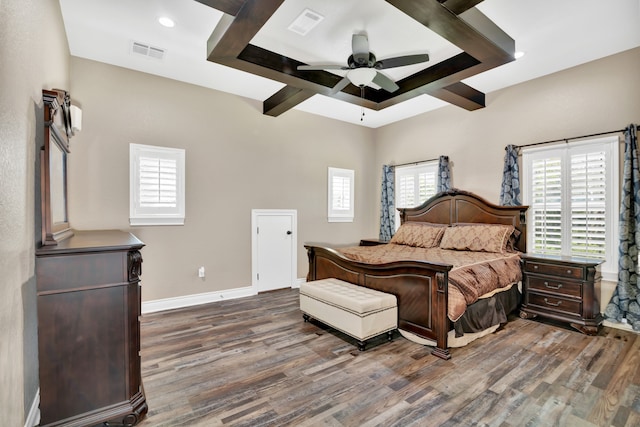 bedroom with ceiling fan, wood-type flooring, and beamed ceiling