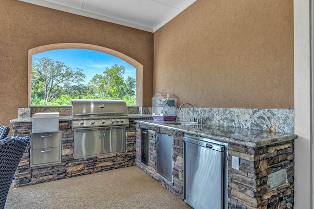 view of patio with sink, area for grilling, and a grill