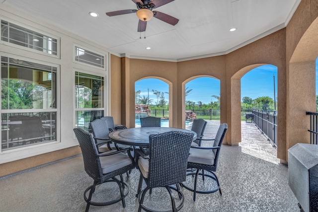 interior space with ceiling fan