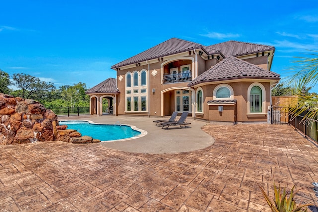 view of swimming pool with a patio area