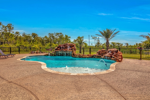 view of pool with pool water feature and a patio area