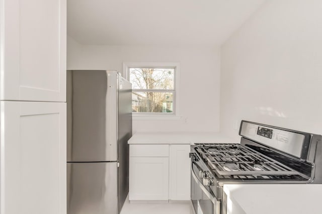 kitchen featuring appliances with stainless steel finishes and white cabinetry