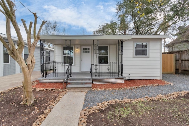 view of front of property featuring covered porch