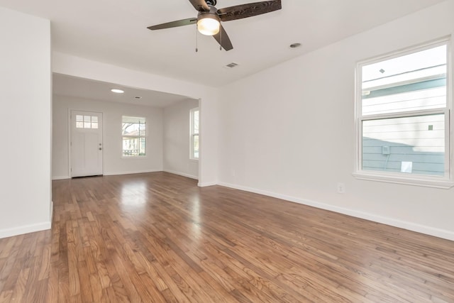 interior space with ceiling fan and light wood-type flooring