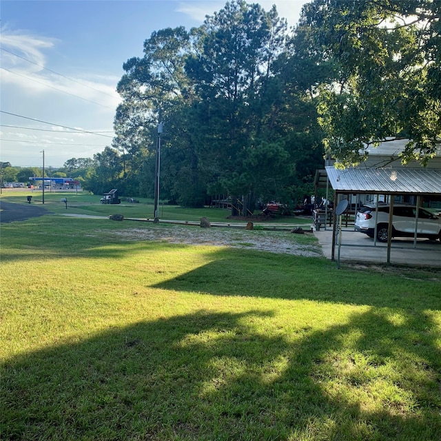 view of yard featuring a carport