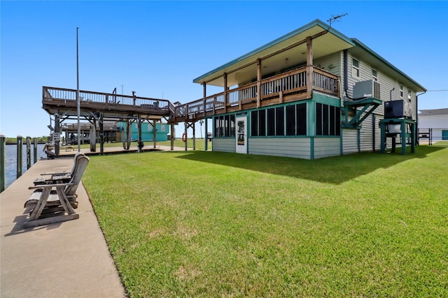 exterior space featuring a water view and a lawn