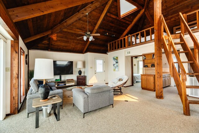 living room with stairway, wooden ceiling, visible vents, and light colored carpet