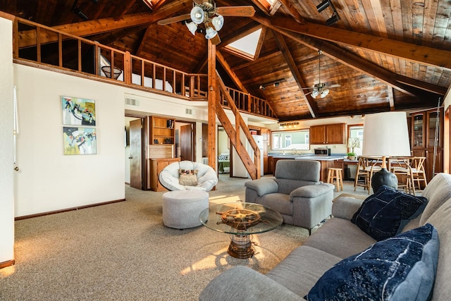 living room featuring sink, wood ceiling, ceiling fan, and carpet flooring