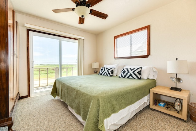 bedroom with access to exterior, ceiling fan, and carpet floors