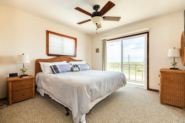 bedroom with access to outside, light colored carpet, and ceiling fan