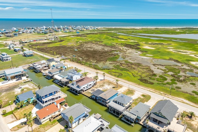 drone / aerial view featuring a residential view and a water view