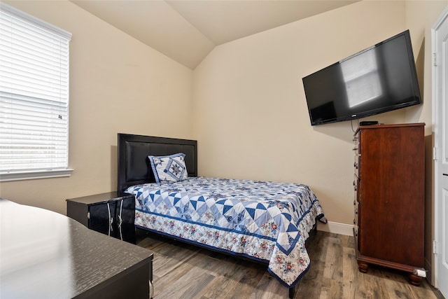 bedroom featuring vaulted ceiling and hardwood / wood-style floors