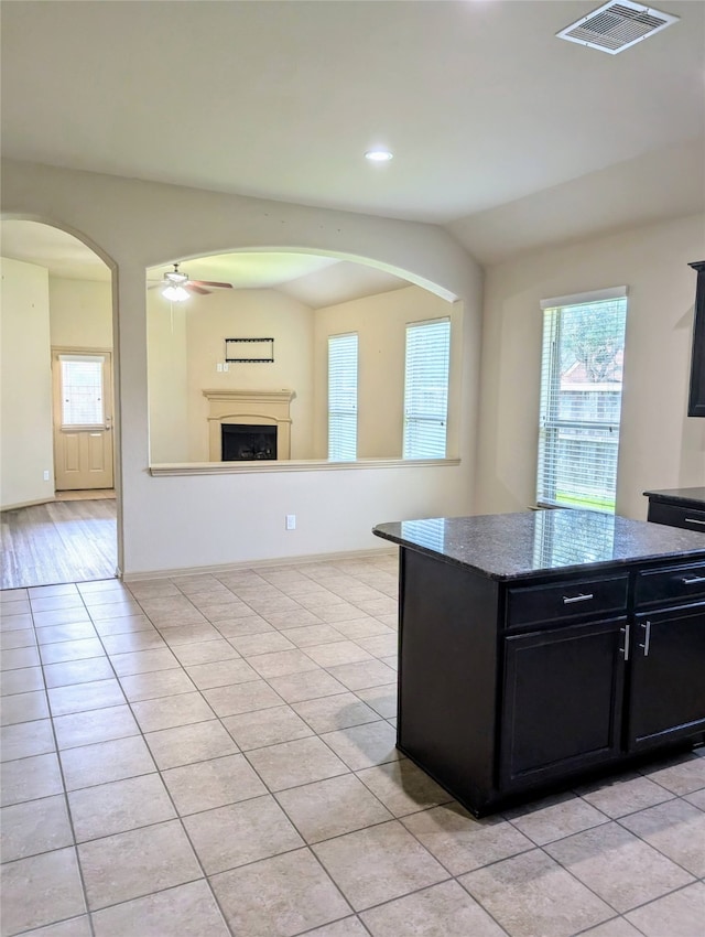 kitchen featuring ceiling fan and light hardwood / wood-style floors