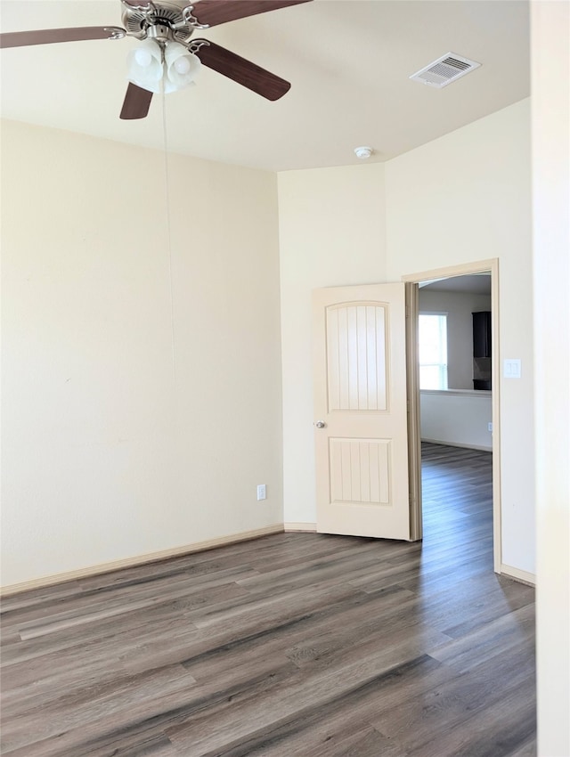 unfurnished room with ceiling fan and dark hardwood / wood-style floors