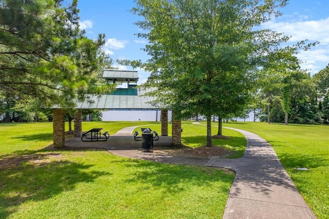 view of property's community with a lawn