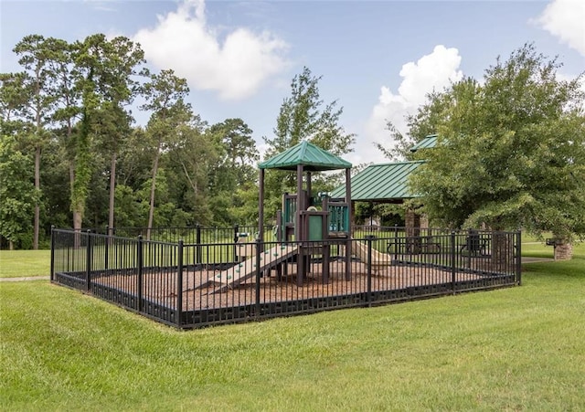 view of jungle gym featuring a lawn