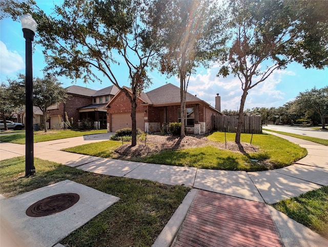 view of front of property with a front yard and a garage