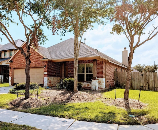 ranch-style home featuring a front lawn and a garage