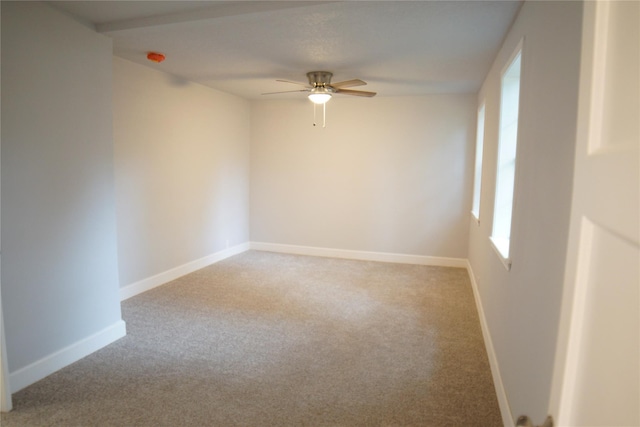 unfurnished room with ceiling fan and light colored carpet