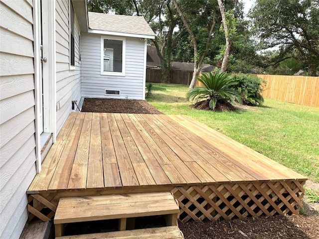 wooden terrace with a yard