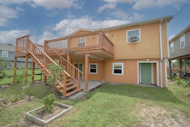 back of property featuring a wooden deck, a lawn, and cooling unit