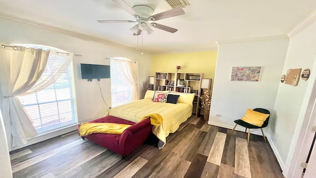 bedroom with ornamental molding, ceiling fan, and dark hardwood / wood-style flooring