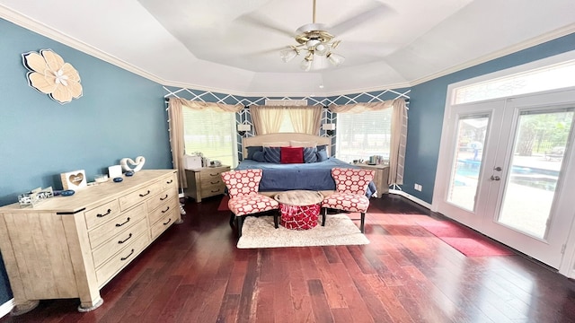 bedroom featuring a raised ceiling, crown molding, dark hardwood / wood-style flooring, and ceiling fan