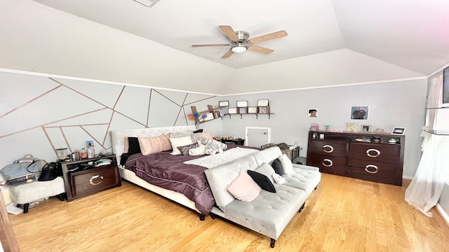 bedroom featuring ceiling fan, vaulted ceiling, and light hardwood / wood-style floors