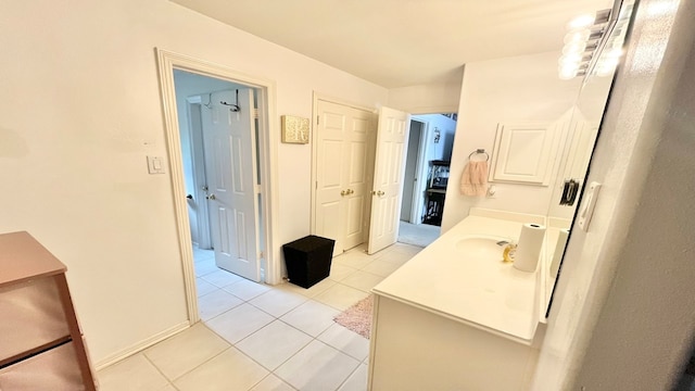 bathroom featuring tile patterned flooring and vanity