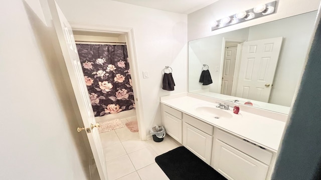 bathroom featuring tile patterned flooring, vanity, and a shower with curtain