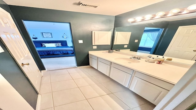 bathroom with vanity and tile patterned floors