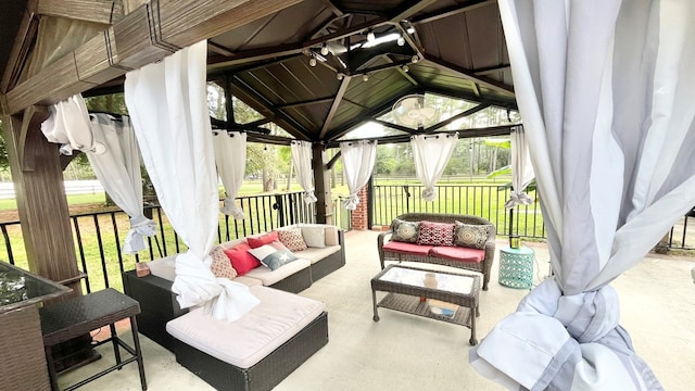 view of patio featuring an outdoor hangout area and a gazebo