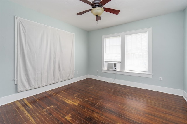 spare room featuring ceiling fan, wood-type flooring, and cooling unit