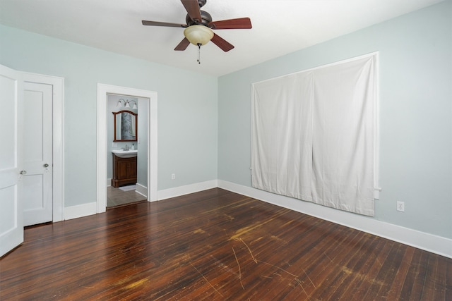 interior space with ceiling fan, sink, and hardwood / wood-style floors