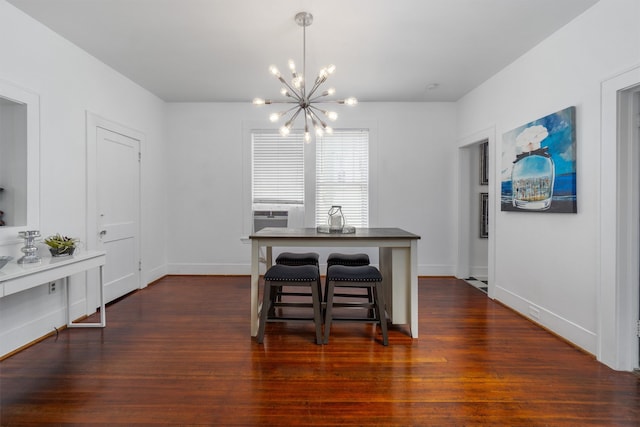 dining area featuring dark hardwood / wood-style flooring and an inviting chandelier