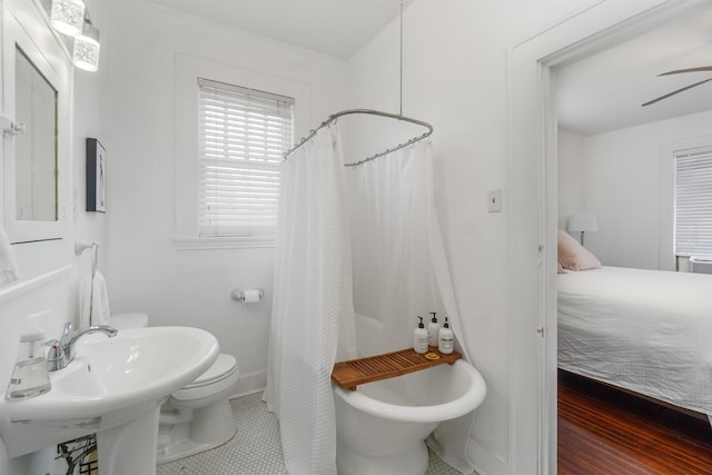 bathroom featuring tile patterned flooring and toilet