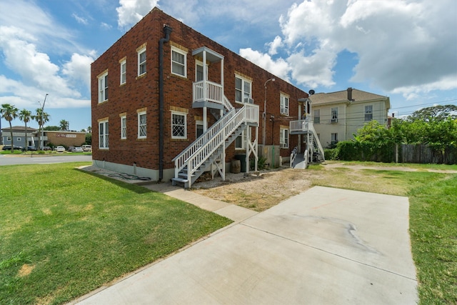 rear view of house with a lawn